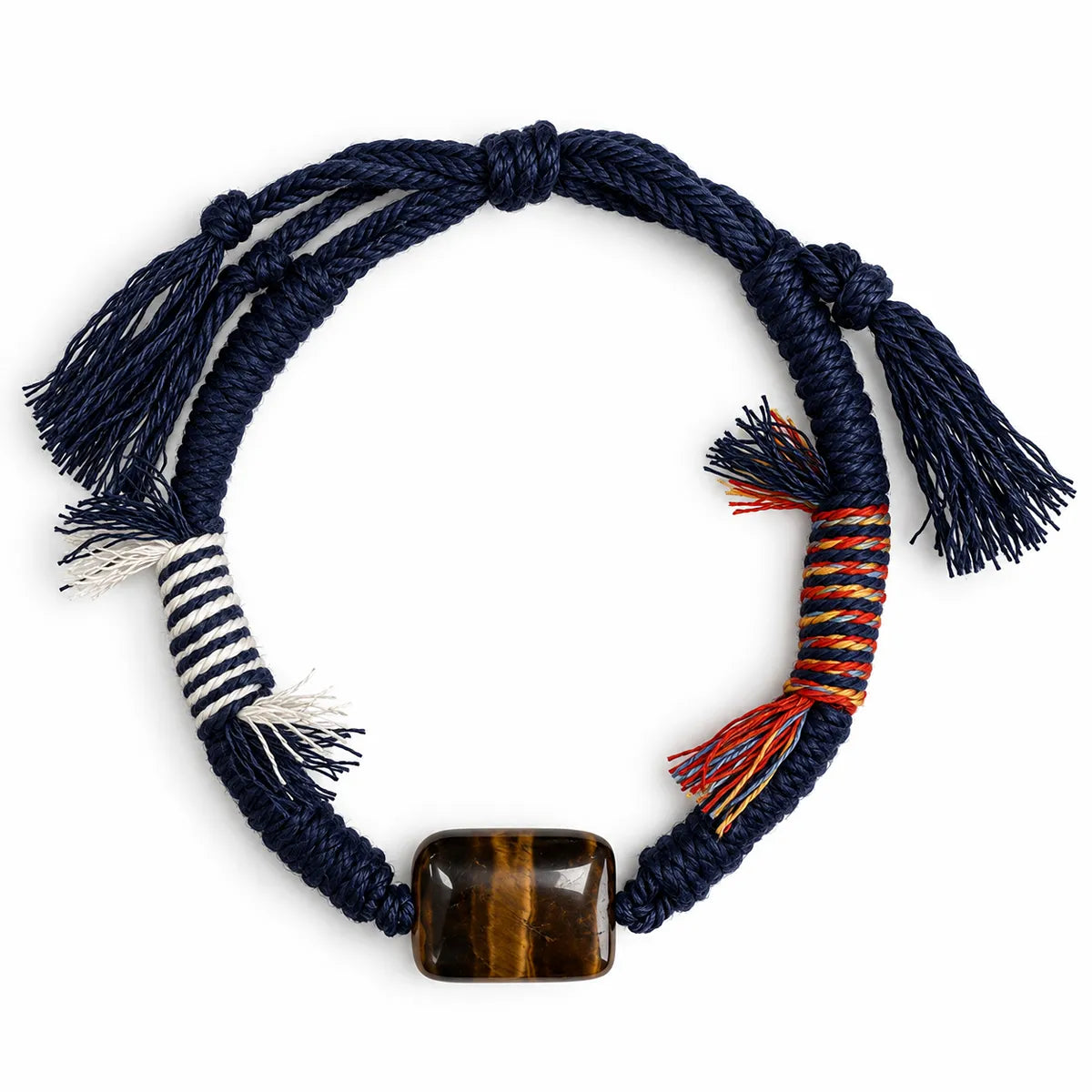 Crystals for confidence bracelet with a rectangular tiger eye stone on navy braided cord with striped and multicolor wraps and tassels
