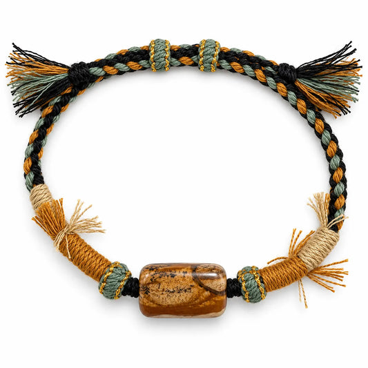 Western style jewelry: picture jasper bracelet with a tan landscape-patterned stone on black, sage, and mustard braided cord