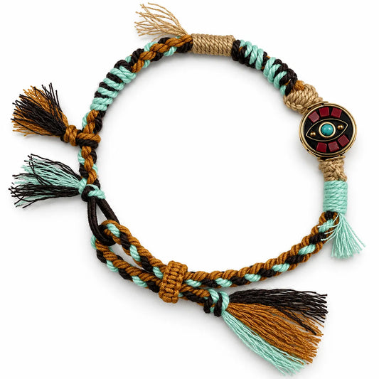 Lucky bracelet with a round brass eye bead on mint, dark brown, and mustard twisted cord with tassels
