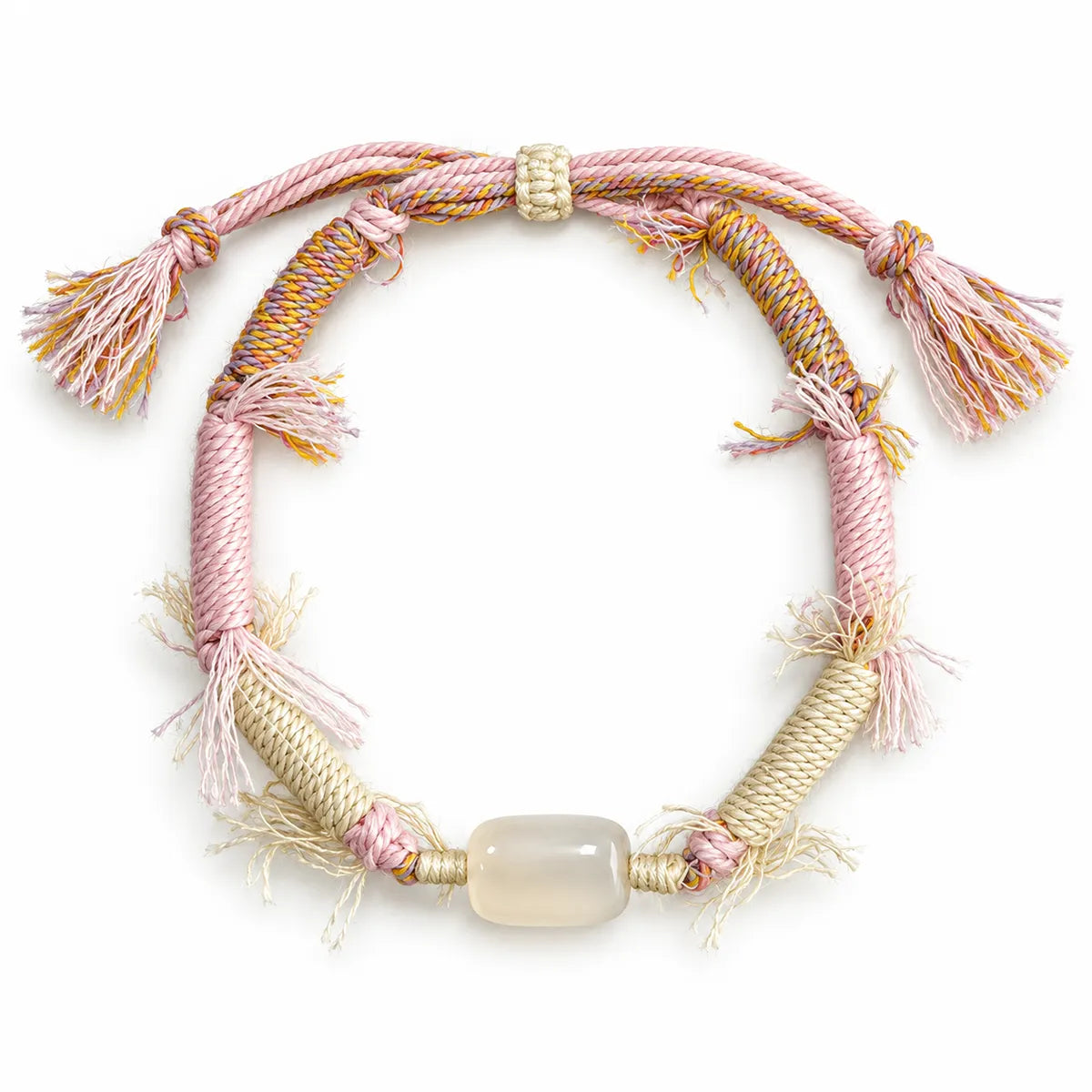 Crystals for love bracelet with a milky barrel-shaped quartz stone on pink and cream wrapped cord with fringe