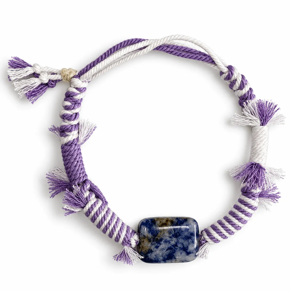Anxiety bracelet with a rectangular blue sodalite stone on lavender and white striped cord with tassels