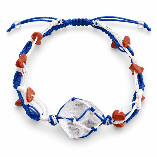 Clear quartz bracelet with a raw clear quartz crystal wrapped in royal blue and white waxed cord with red man-made goldstone chips