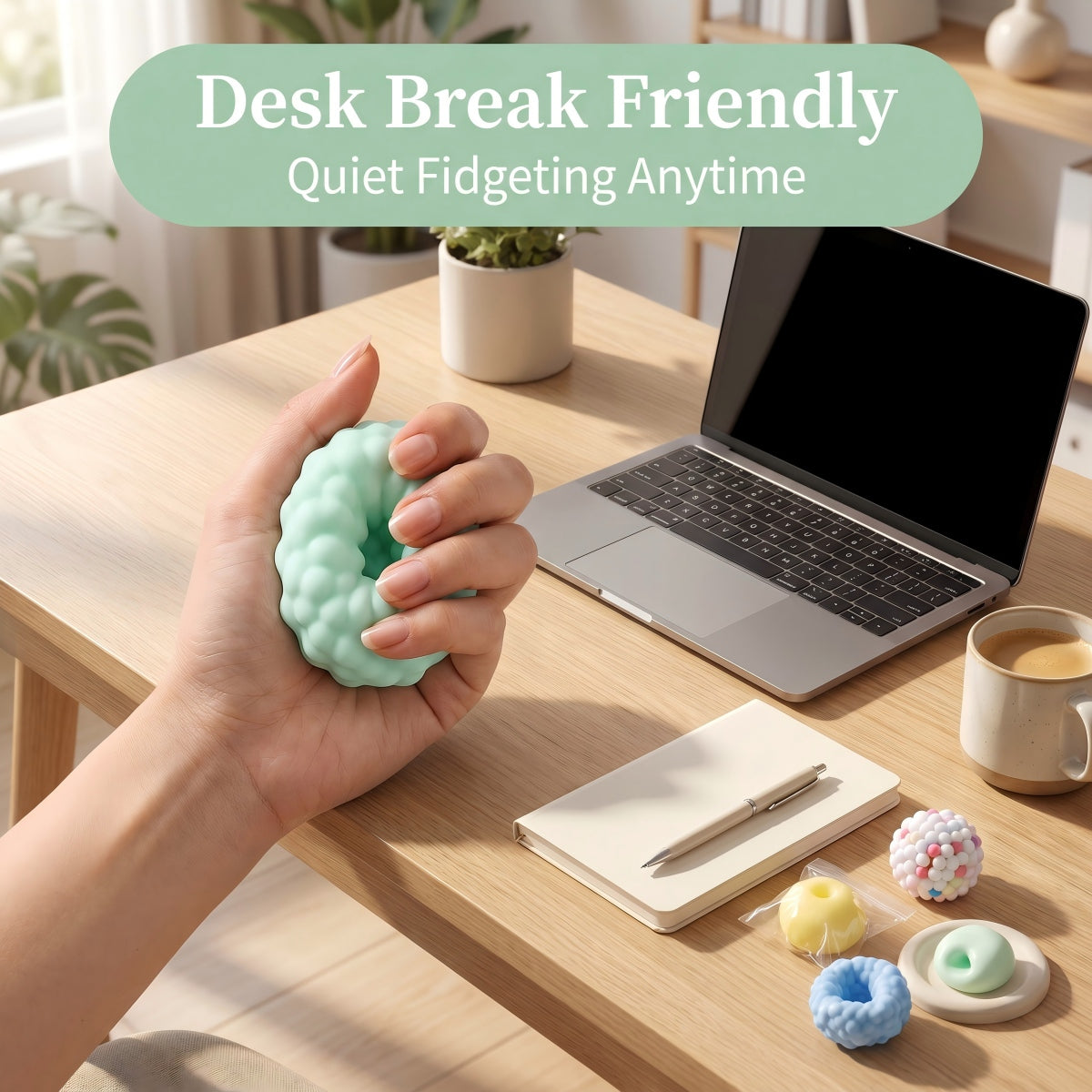 Hand squeezing a textured squishy fidget toy beside a laptop for quiet desk breaks and everyday office fidgeting