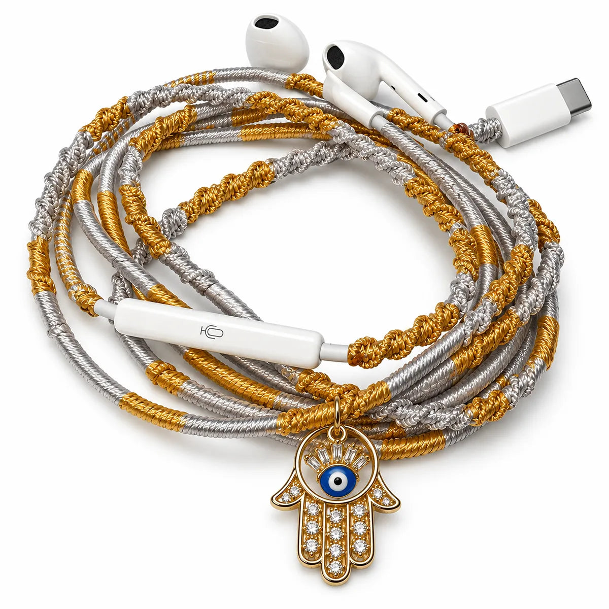 Hamsa hand evil eye charm on hand-wrapped gold and silver wired earphones with USB-C connector