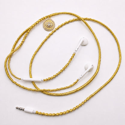 evil eye sunburst medallion earphone charm on white background
