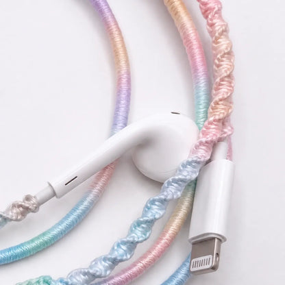  Extreme macro of lavender dominant pastel gradient wrapped earphone cord showing detailed soft purple spiral thread blending into blush and mint for fairycore pastel detail ad 
