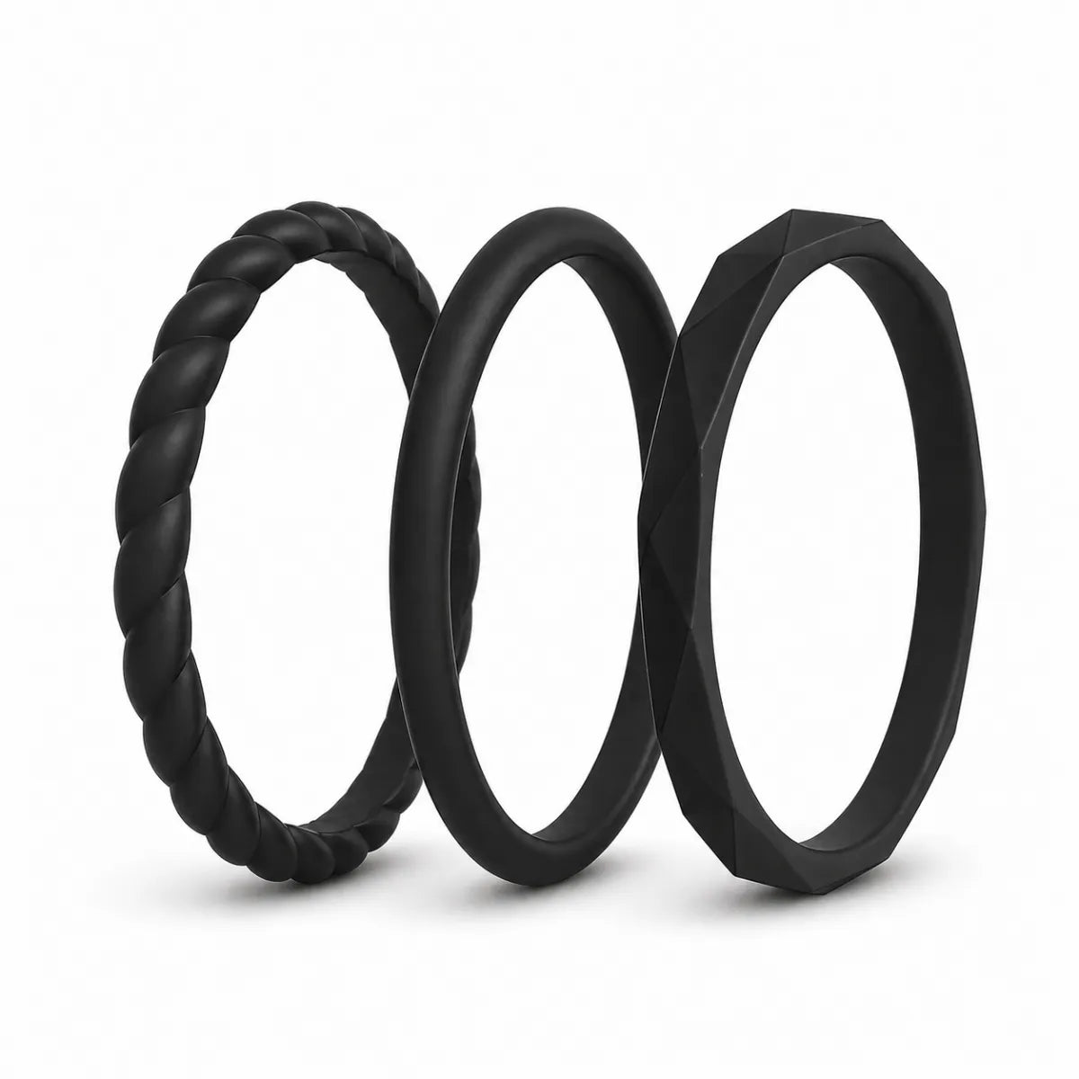Norelva Midnight Black stackable silicone rings for women, 3-pack wedding band set on white background