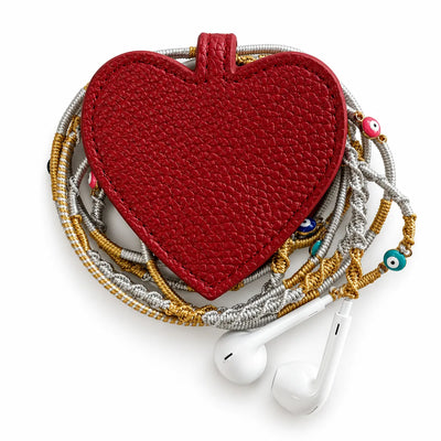 heart earphone pouch with gold and silver braided earphones, top view